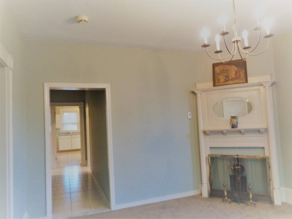 29 Lewis Street, Unit 2 Lynn, MA 01902 - Photo 7 of 22 a view of a hallway to rooms and wooden floor