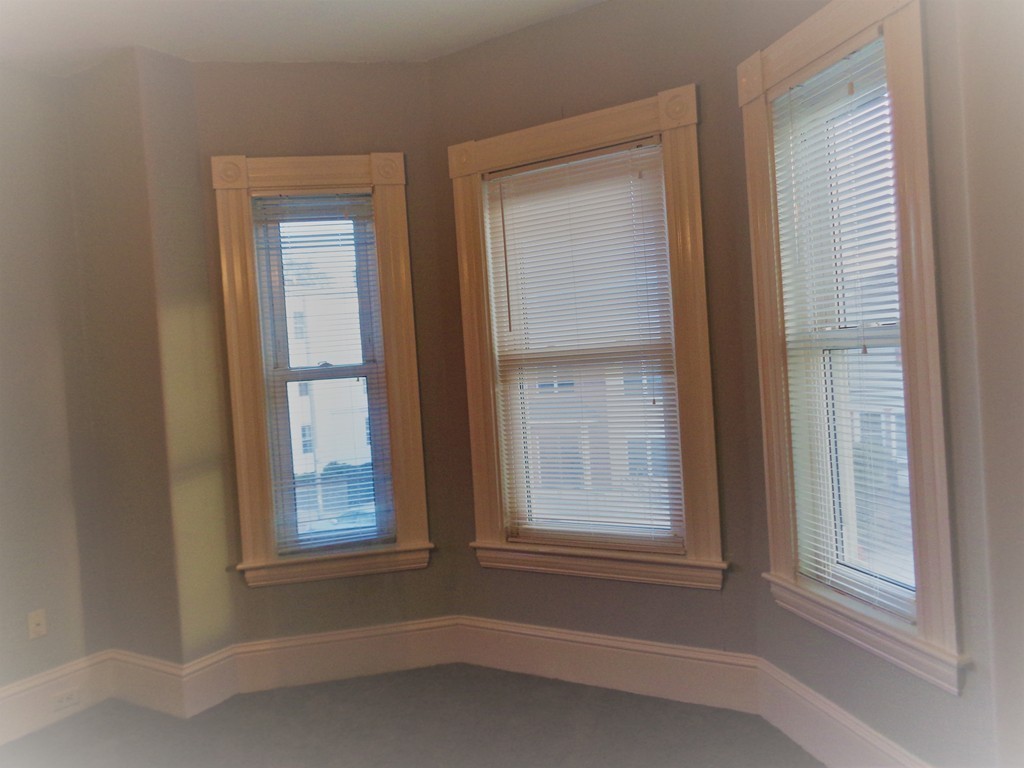 29 Lewis Street, Unit 2 Lynn, MA 01902 - Photo 8 of 22 an empty room that has a window
