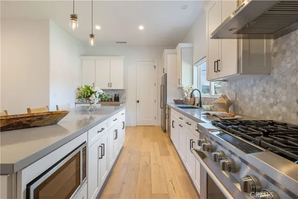 a kitchen with cabinets and a closet
