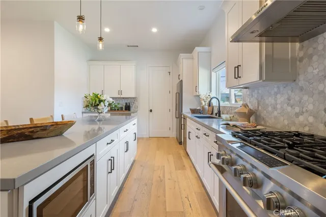 a kitchen with cabinets and a closet