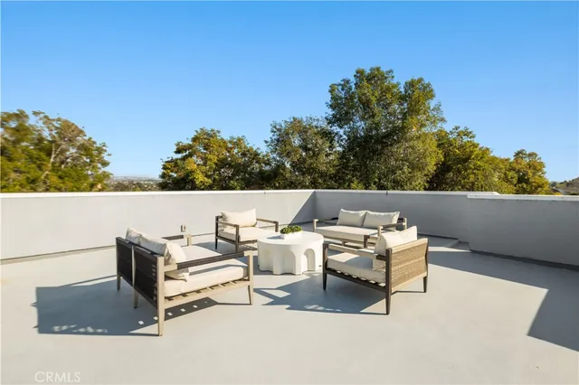a view of a house with a yard porch and furniture