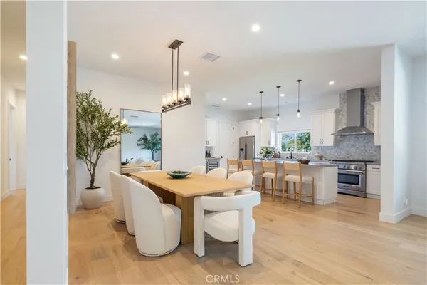 a living room with furniture a wooden floor and a table