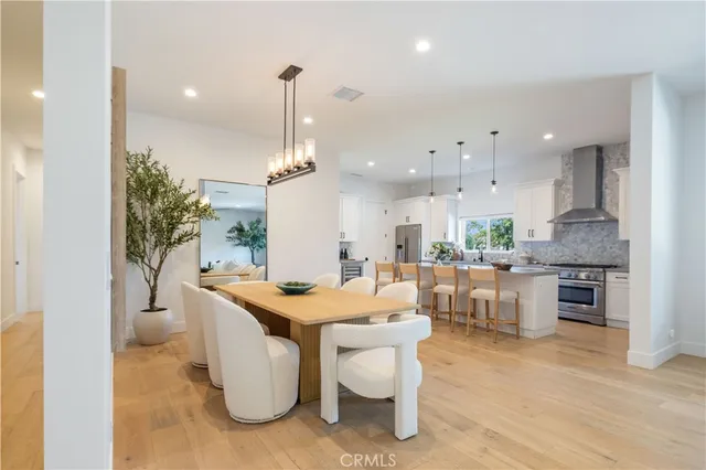 a living room with furniture a wooden floor and a table