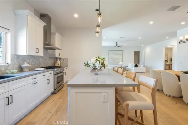 a kitchen with a sink and stove