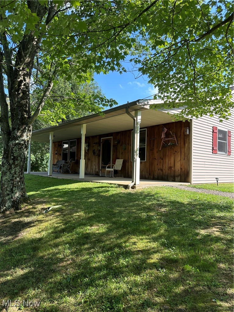 48864 Dry Ridge Road Clarington, OH 43915 - Photo 1 of 49 Front view of house featuring a yard