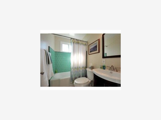 2216 Laurel Drive Santa Clara, CA 95050 - Photo 7 of 9 a picture of a living room with a sink and a large mirror