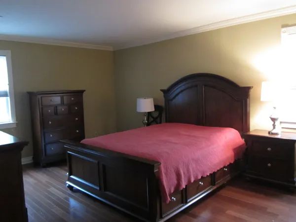 a bedroom with a bed and a closet