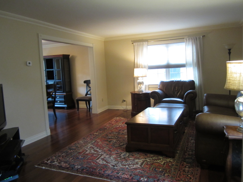 67 New England Avenue, Unit F Summit, NJ 07901 - Photo 2 of 16 a living room with furniture and a window