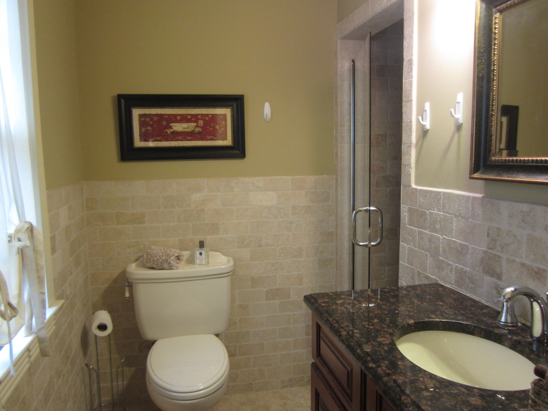 67 New England Avenue, Unit F Summit, NJ 07901 - Photo 10 of 16 a bathroom with a granite countertop toilet sink and mirror