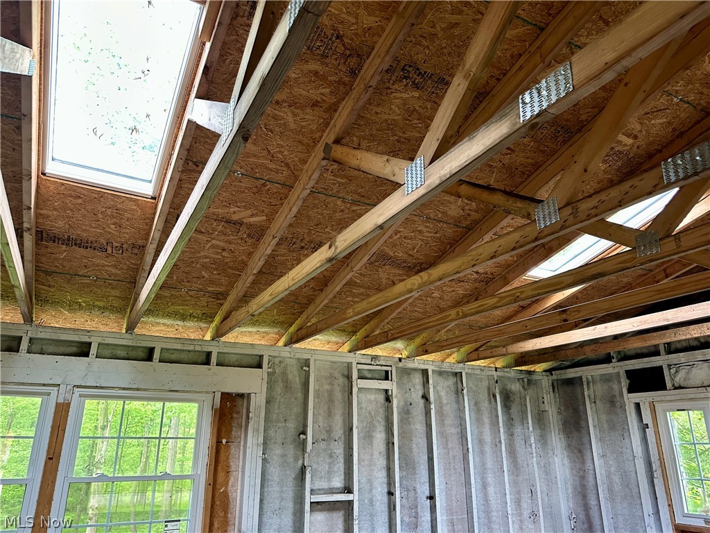 5319 Fairtree Road Bedford Heights, OH 44146 - Photo 15 of 27 Vaulted ceiling with exposed wood beams and multiple skylights