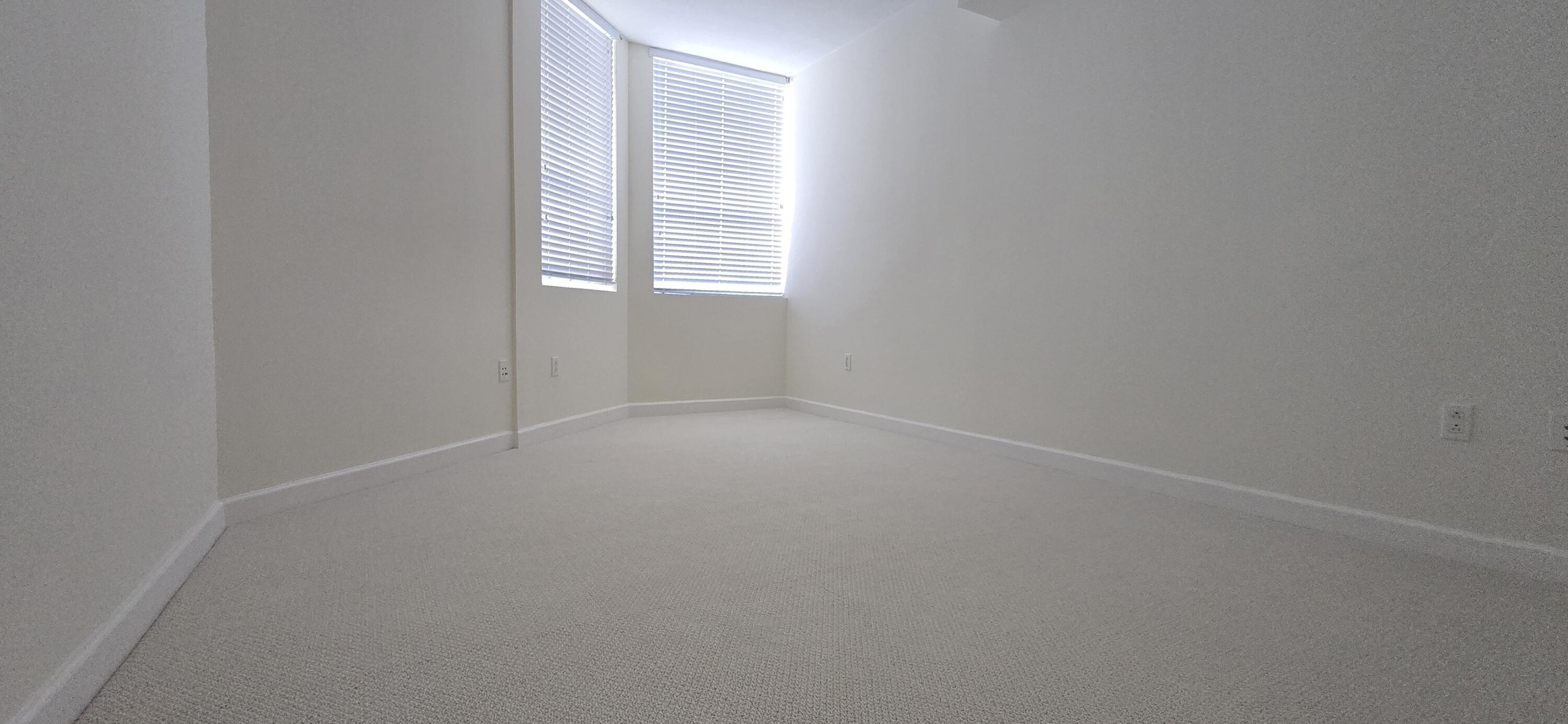 410 Evernia Street, Unit 616 West Palm Beach, FL 33401 - Photo 7 of 23 an empty room with windows