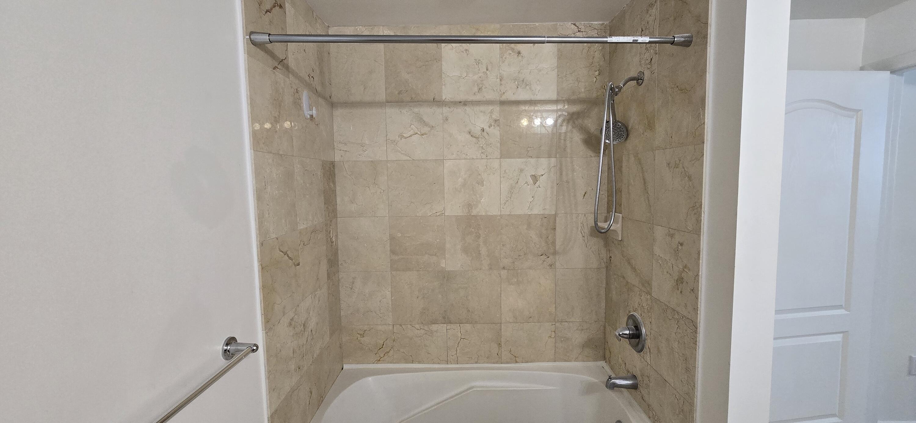 410 Evernia Street, Unit 616 West Palm Beach, FL 33401 - Photo 9 of 23 a bathroom with a shower