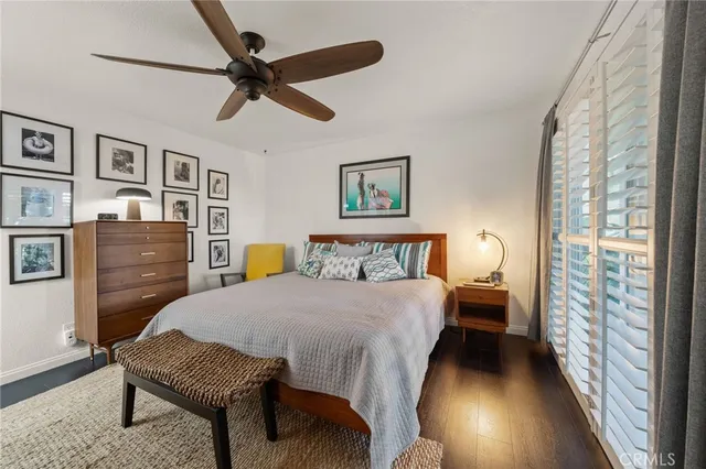 a bedroom with a bed and a table