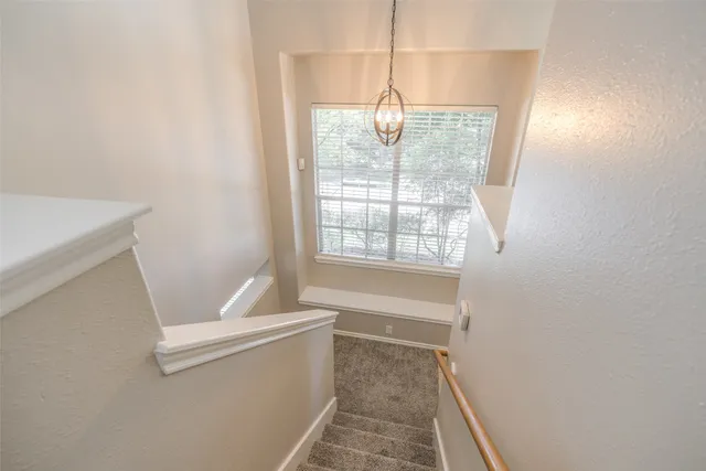 a bathroom with a sink window and tub