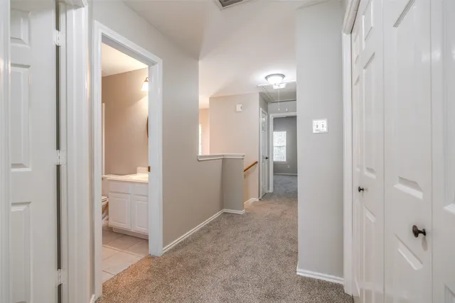 a view of a bathroom from a hallway