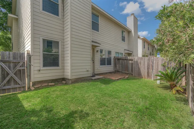 a view of a back yard of the house
