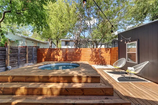 a view of backyard of house with outdoor seating