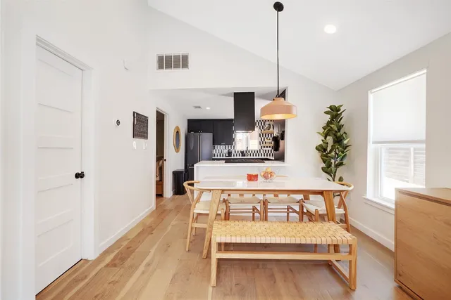 a bedroom with furniture and a chandelier