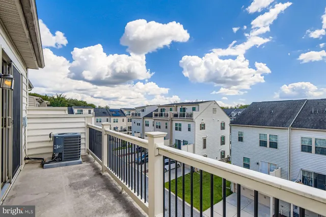 a view of a balcony with wooden floor
