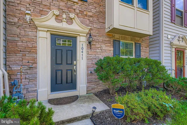 a front view of a house with parking area