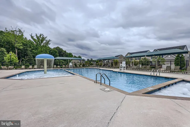 a view of a swimming pool with a patio