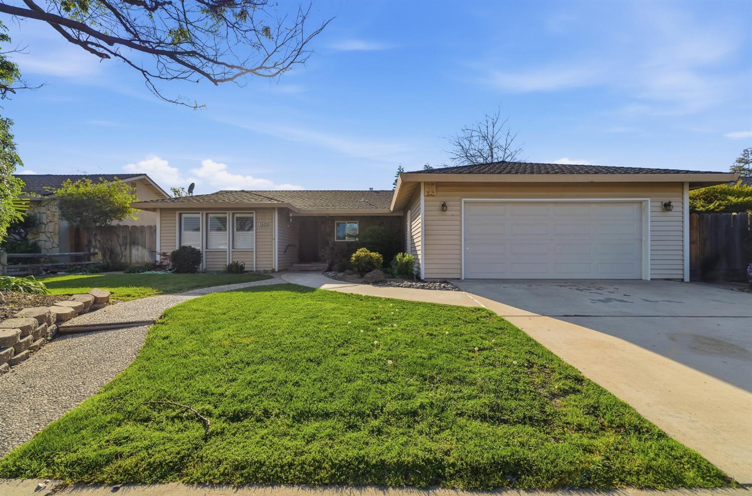 1509 Maplehill Road Modesto, CA 95350 - Photo 1 of 1 a front view of a house with garden