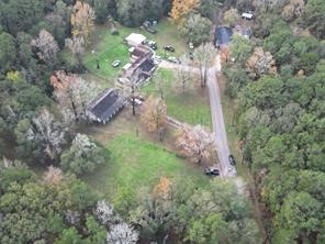 3307 Hamilton Circle Conroe, TX 77304 - Photo 16 of 16 a backyard of a house with lots of green space