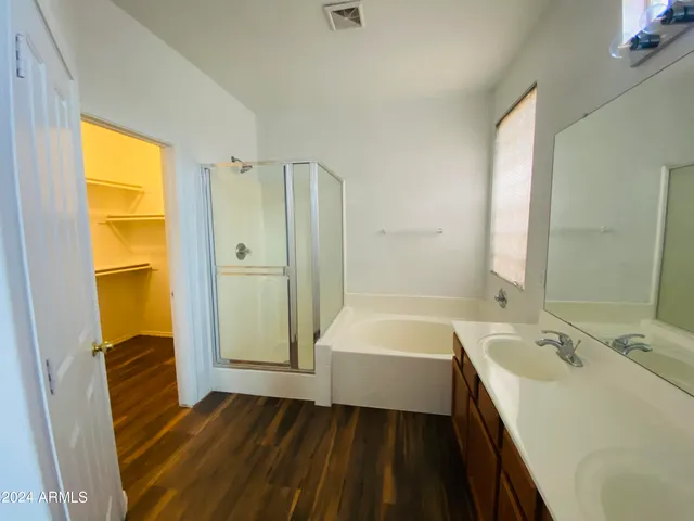 a bathroom with a sink a bathtub and a shower