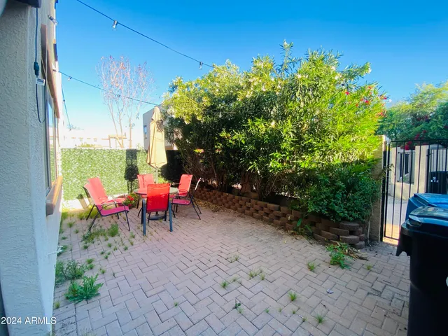 a view of a chairs and table in the patio