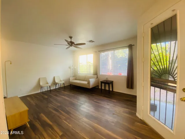 a living room with furniture and a window