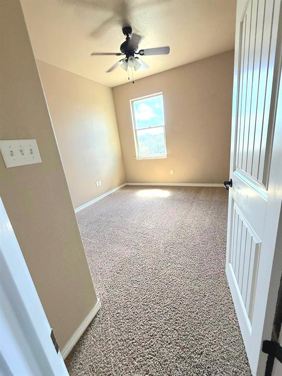 1118 Elk Ridge Drive Stephenville, TX 76401 - Photo 7 of 40 a view of an empty room and a window