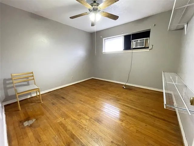 a view of a livingroom with furniture and windows