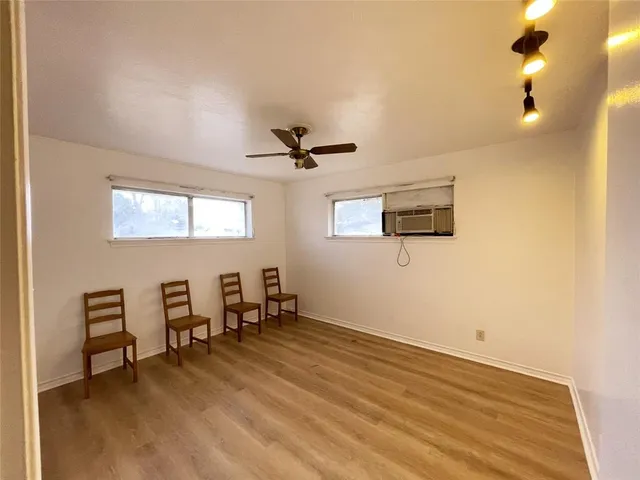 a bathroom with a bathtub sink and mirror