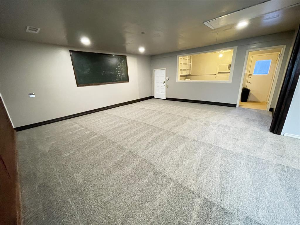 203 Abrams Road Richardson, TX 75081 - Photo 6 of 29 a view of an empty room with a window