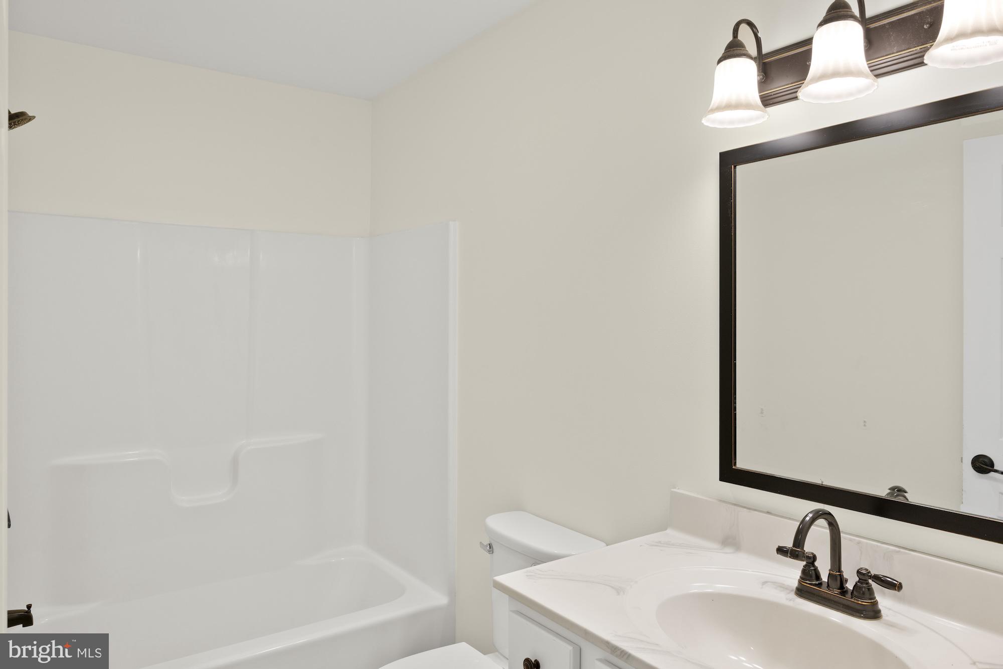 599 Hilltown Road Gettysburg, PA 17325 - Photo 23 of 49 a bathroom with a sink and a mirror
