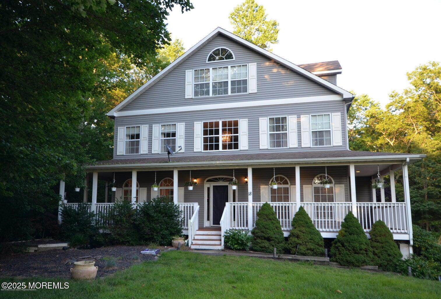 a front view of a house with a yard and porch