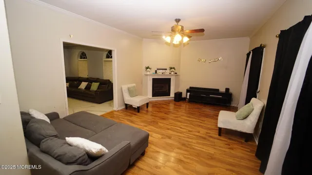 a living room with furniture and a fireplace