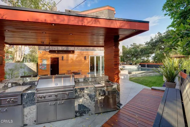 a view of a water fountain in front of the house