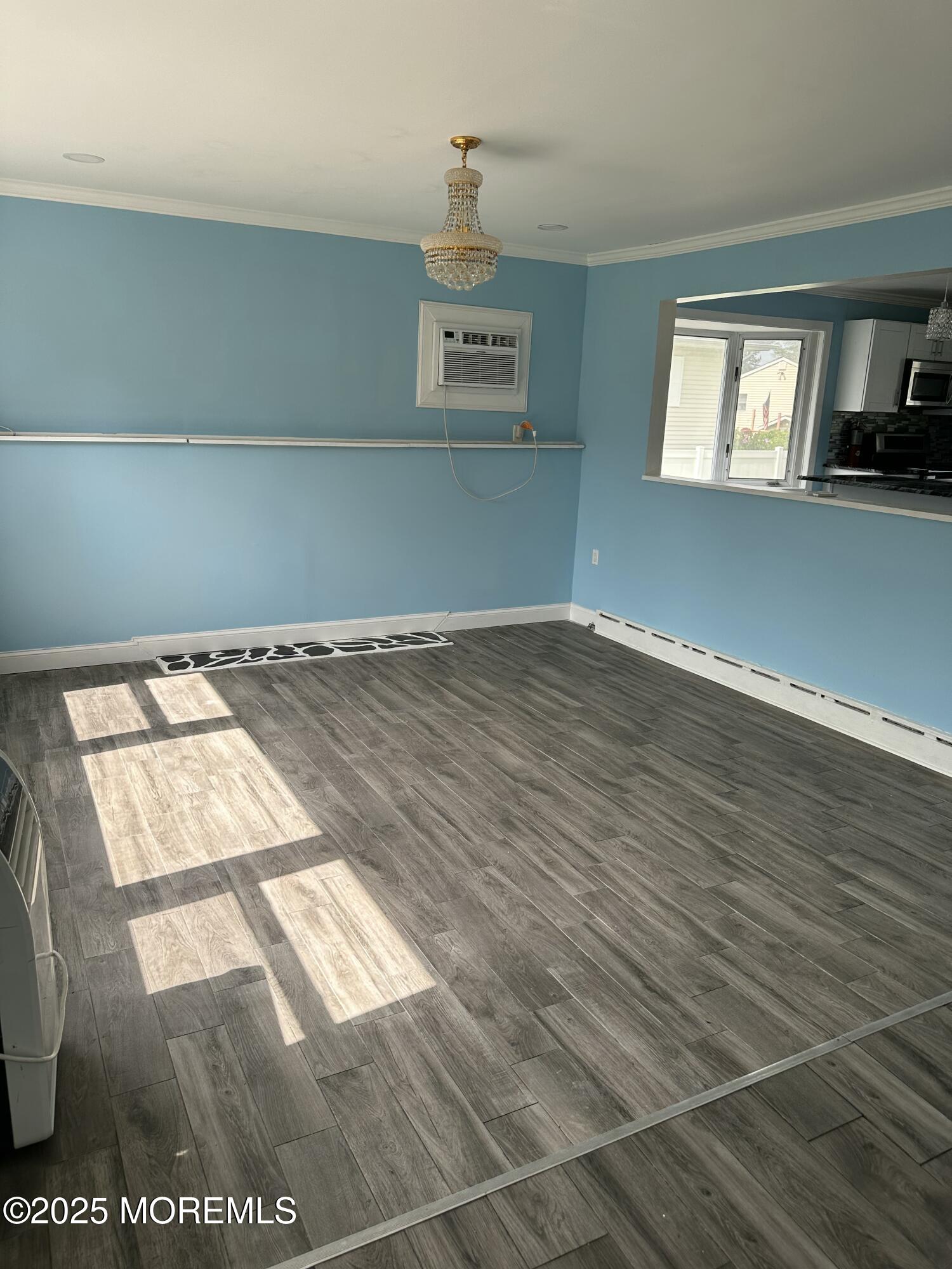 308 Myrtle Street Cliffwood, NJ 07721 - Photo 16 of 44 a view of an empty room with wooden floor and a window