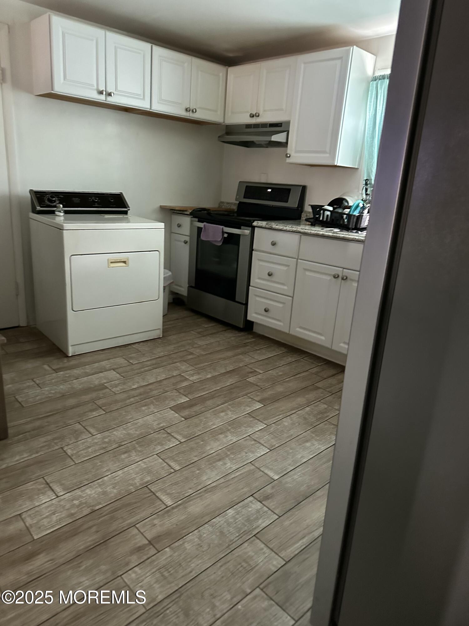308 Myrtle Street Cliffwood, NJ 07721 - Photo 18 of 44 a kitchen with stainless steel appliances granite countertop a stove a sink and a refrigerator