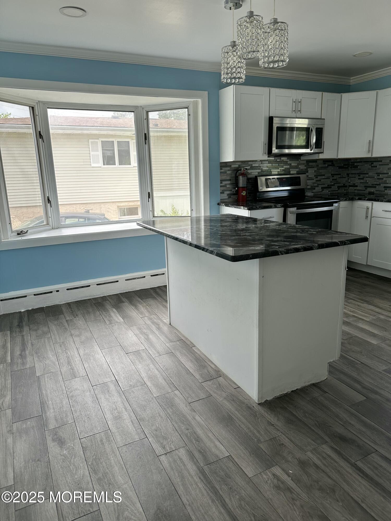 308 Myrtle Street Cliffwood, NJ 07721 - Photo 27 of 44 a kitchen with stainless steel appliances granite countertop a sink and a granite counter tops