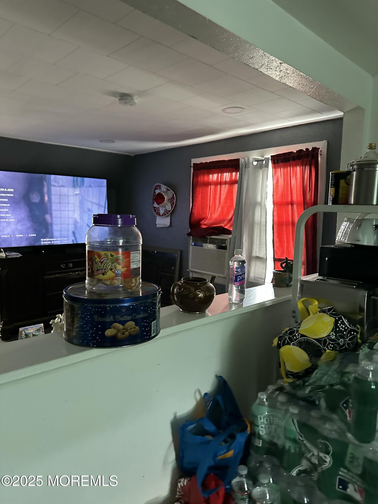 308 Myrtle Street Cliffwood, NJ 07721 - Photo 35 of 44 a living room with furniture a flat screen tv and a fireplace