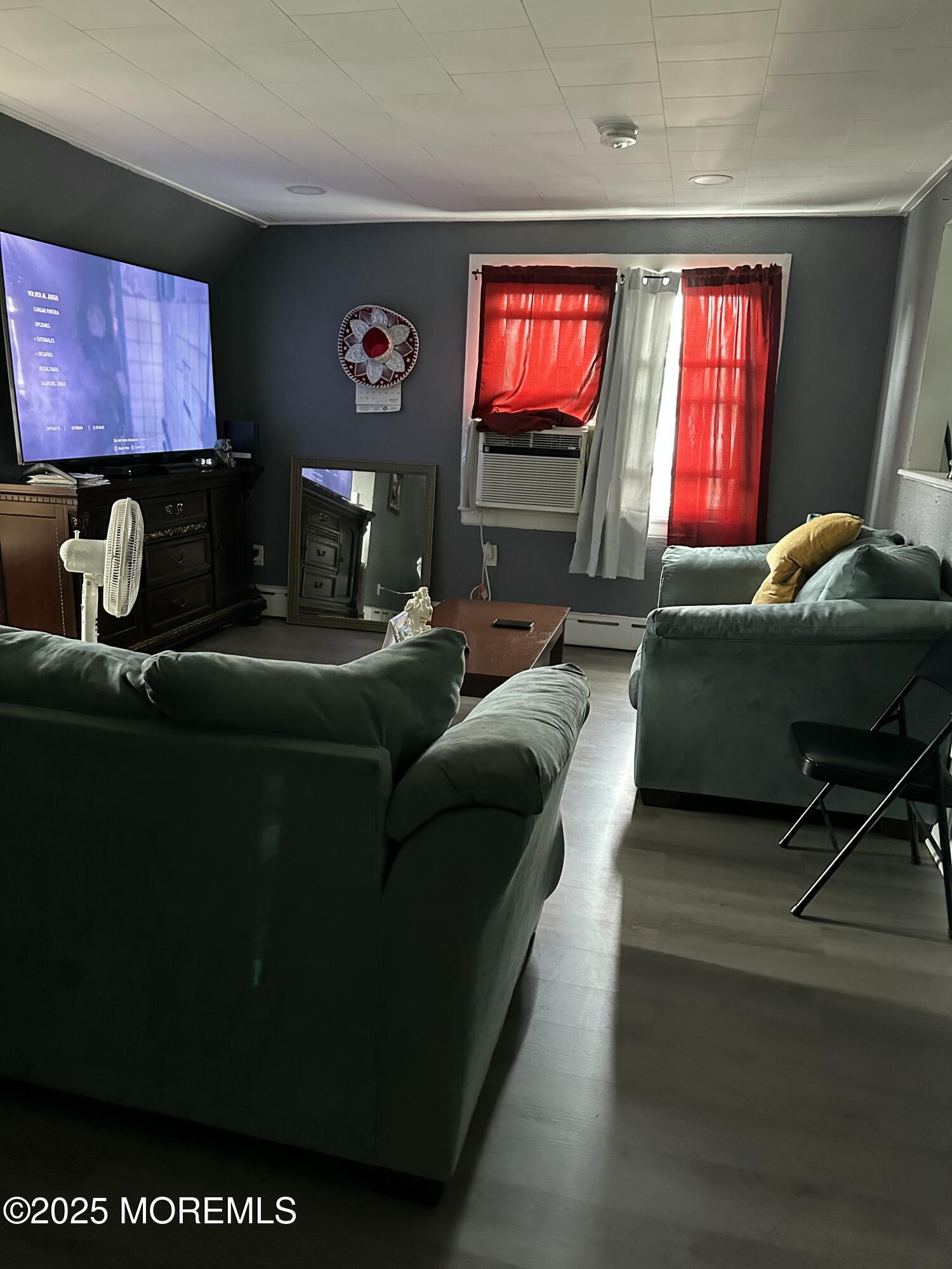 308 Myrtle Street Cliffwood, NJ 07721 - Photo 36 of 44 a living room with furniture and a flat screen tv