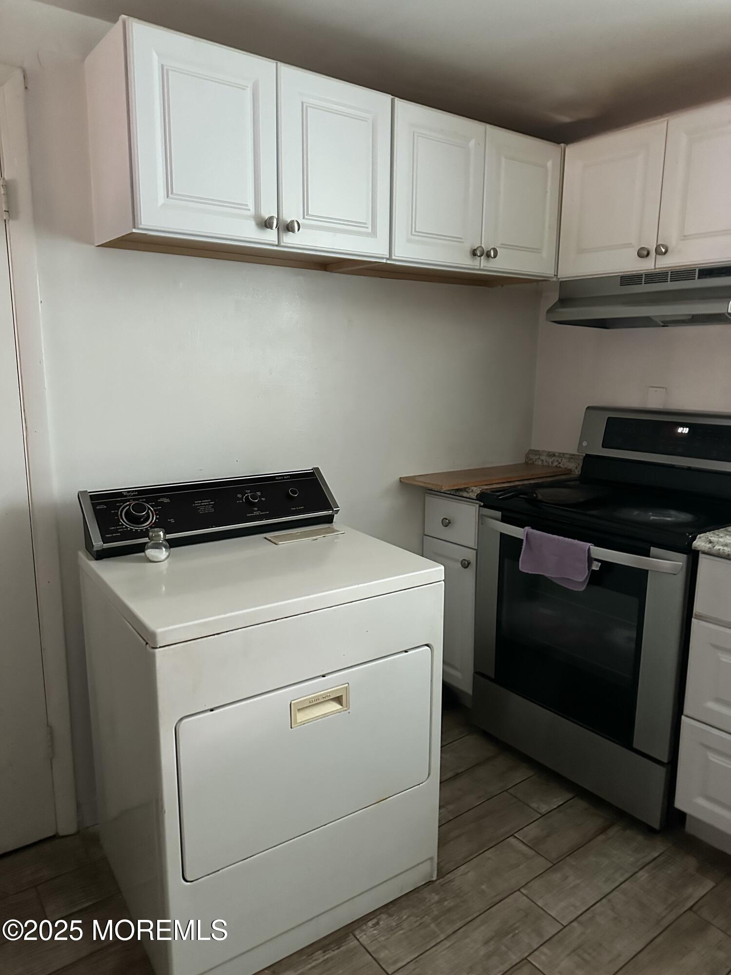 308 Myrtle Street Cliffwood, NJ 07721 - Photo 39 of 44 a kitchen with a stove and a microwave