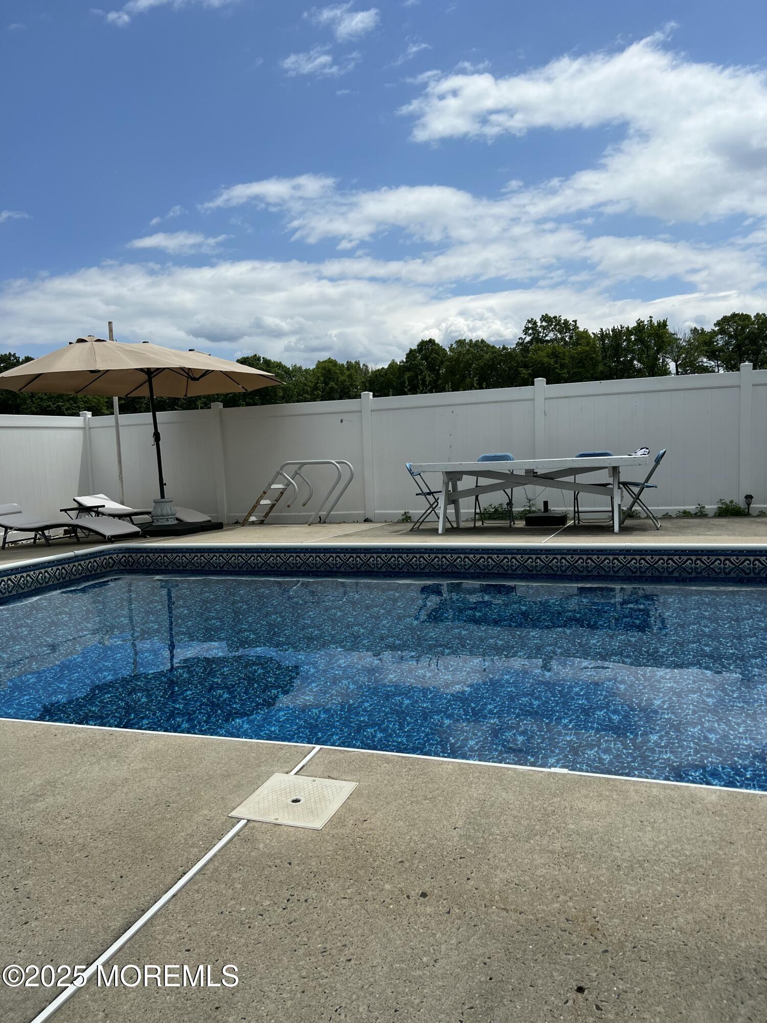 308 Myrtle Street Cliffwood, NJ 07721 - Photo 42 of 44 a view of a swimming pool and an outdoor seating