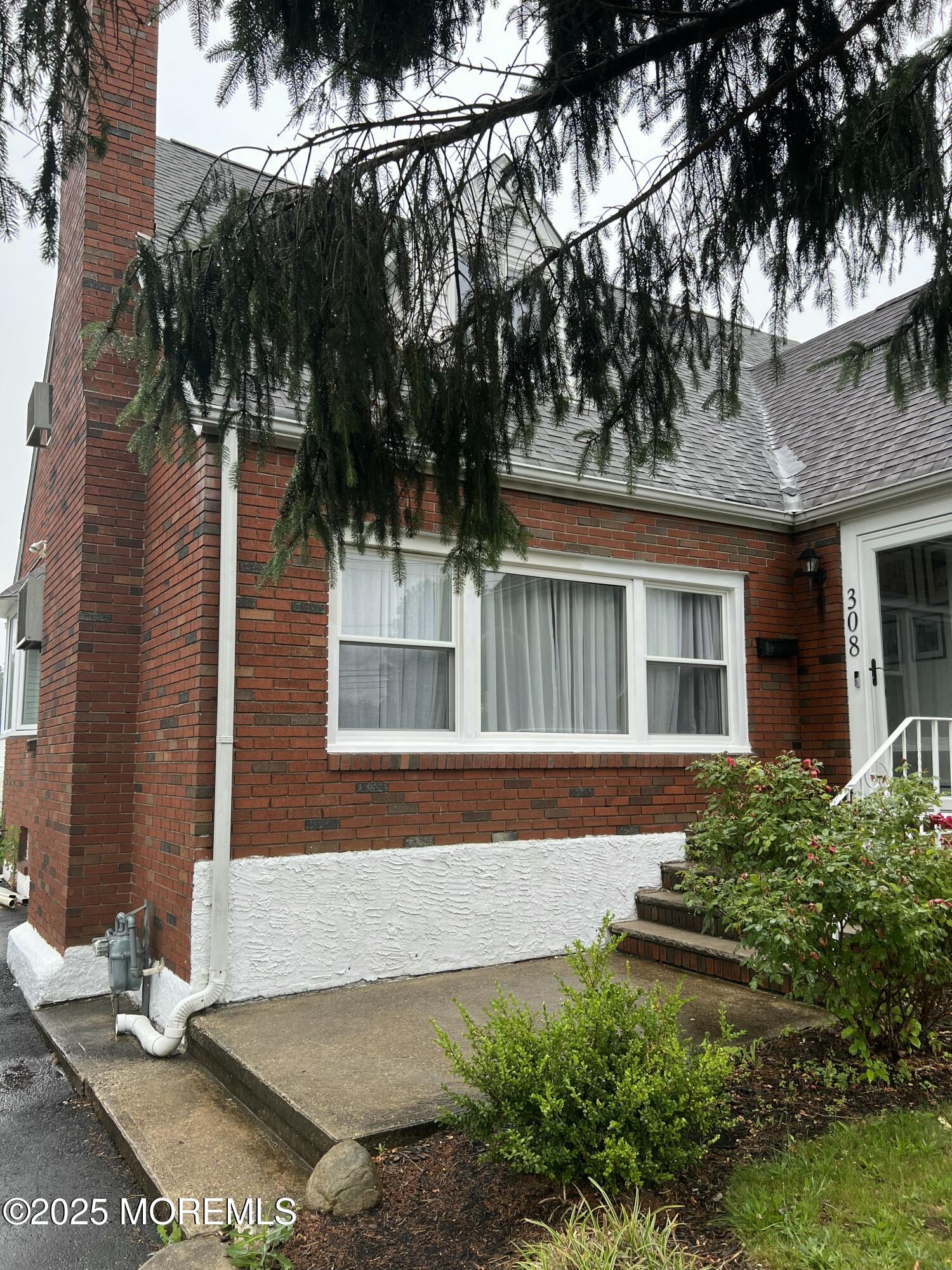 308 Myrtle Street Cliffwood, NJ 07721 - Photo 6 of 44 front view of a house with a yard