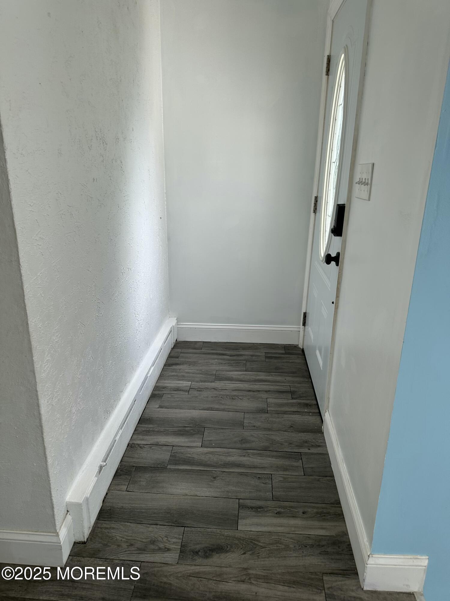 308 Myrtle Street Cliffwood, NJ 07721 - Photo 7 of 44 a view of a hallway with wooden floor and entryway