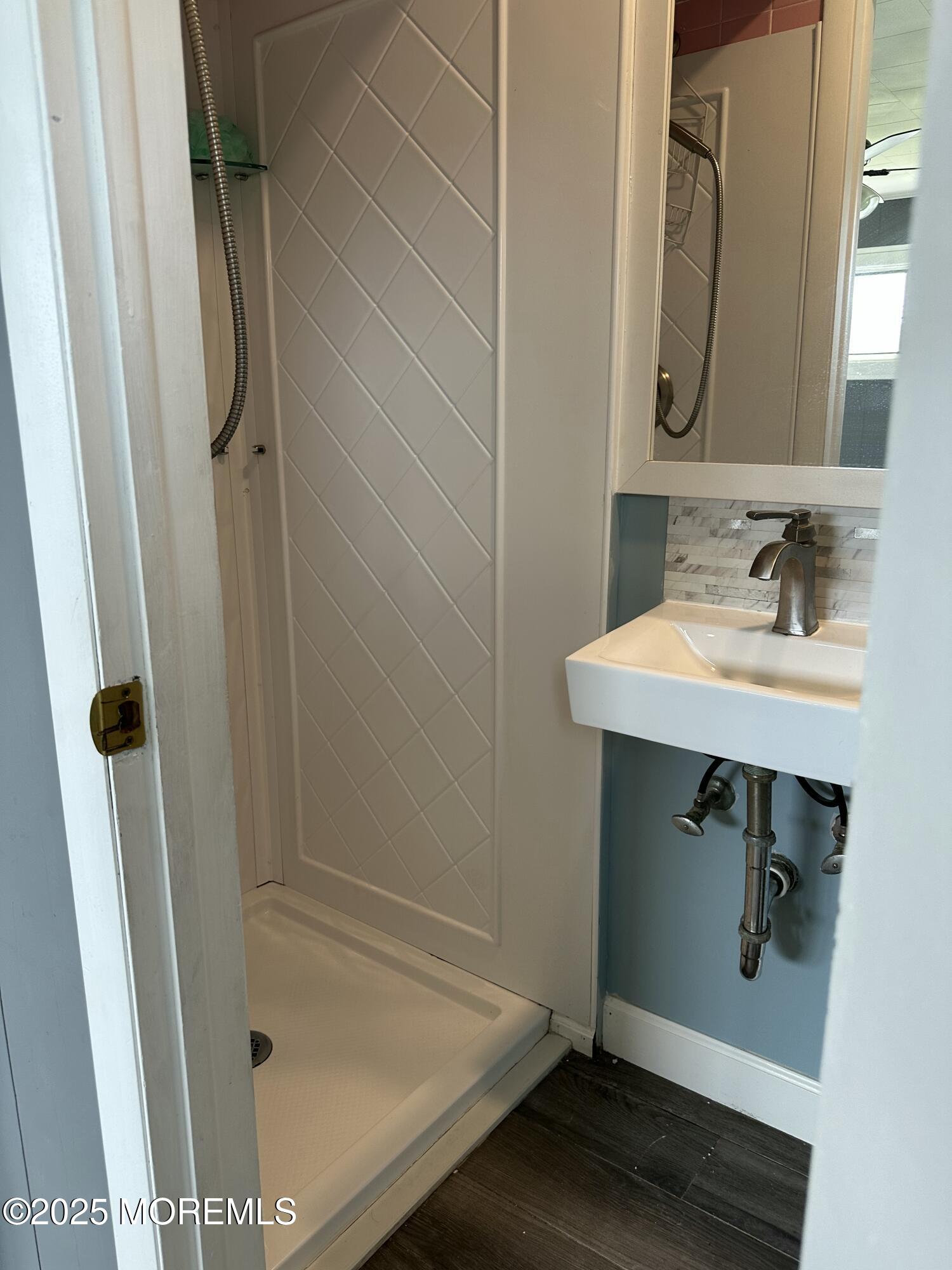 308 Myrtle Street Cliffwood, NJ 07721 - Photo 10 of 44 a bathroom with a sink a mirror and shower