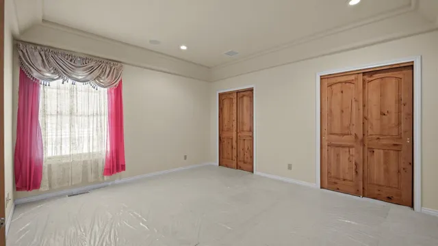 a bathroom with a granite countertop sink a large mirror and a shower