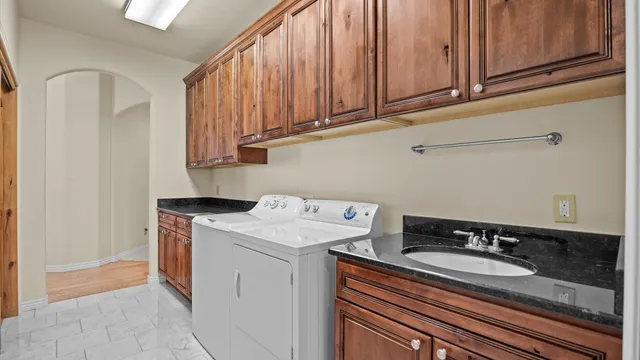 a view of a hallway with washer and dryer